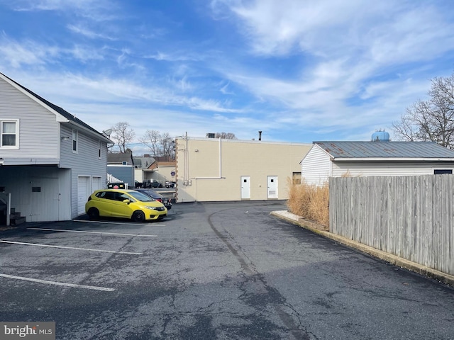 uncovered parking lot with fence