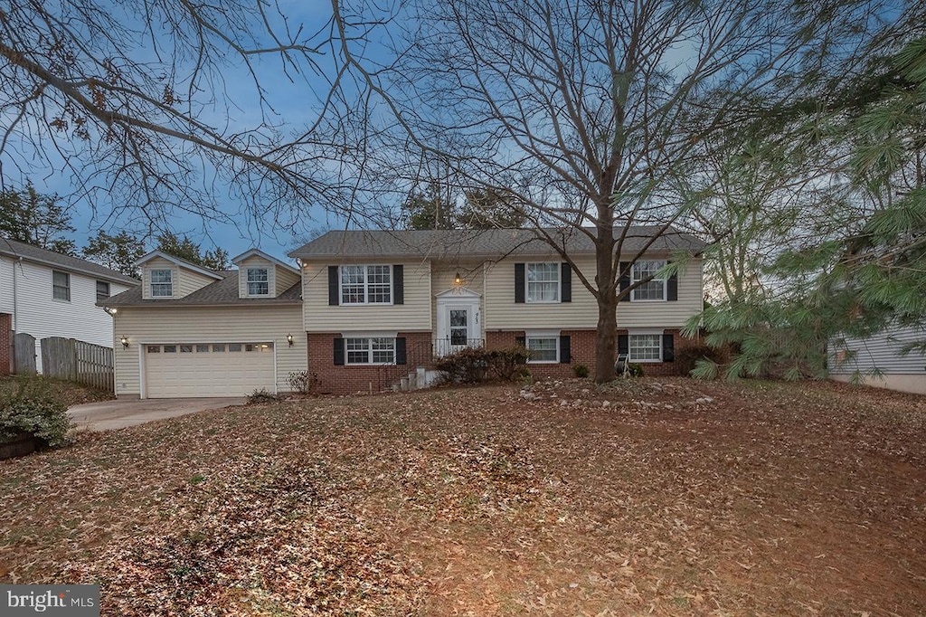 raised ranch featuring a garage