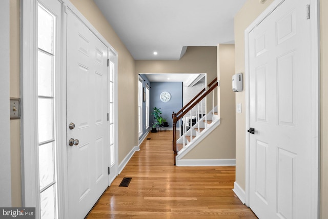 entryway with light hardwood / wood-style flooring