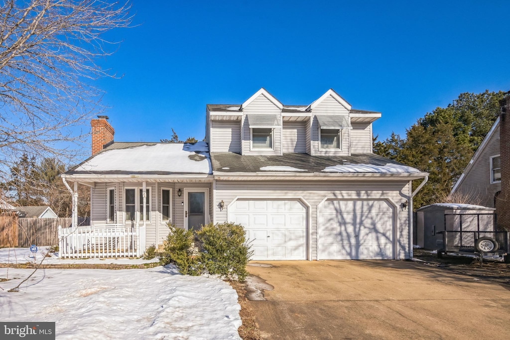 view of front of property featuring a garage and covered porch