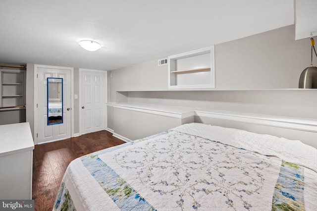 bedroom featuring dark hardwood / wood-style flooring