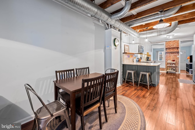 dining area with dark hardwood / wood-style floors