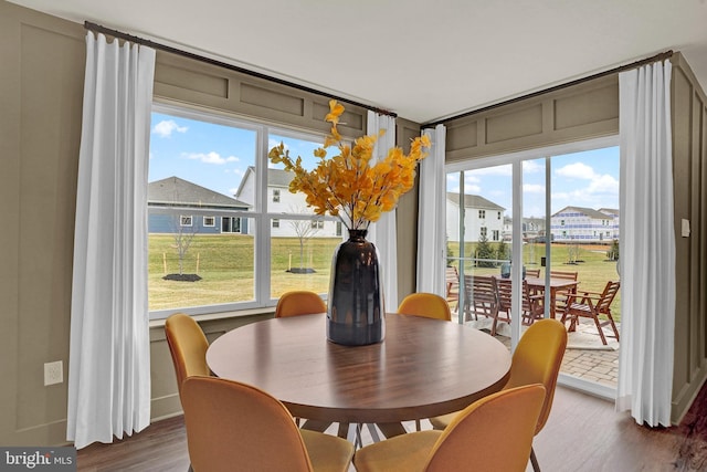 dining room with hardwood / wood-style flooring