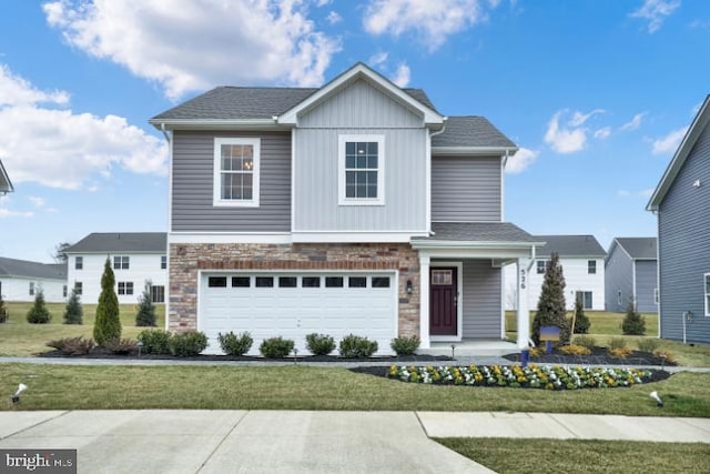 view of front of property with a garage and a front yard