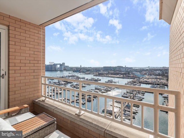 balcony featuring a water view