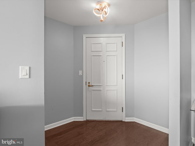 foyer with dark wood-type flooring