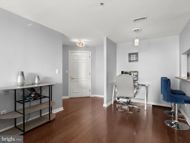 office space with dark hardwood / wood-style flooring