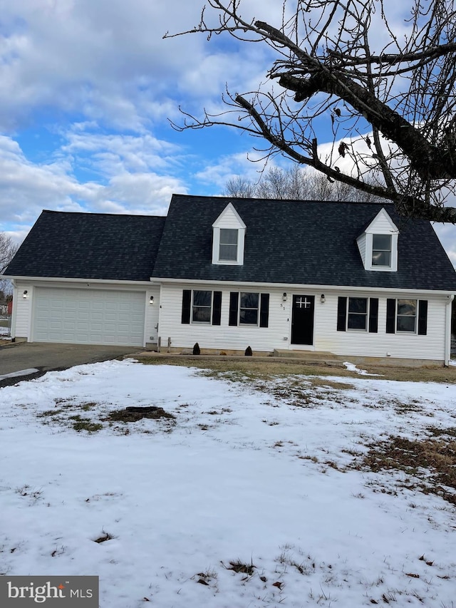 new england style home with a garage