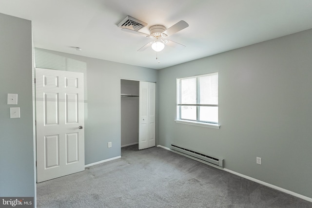 unfurnished bedroom featuring ceiling fan, a closet, light colored carpet, and a baseboard radiator