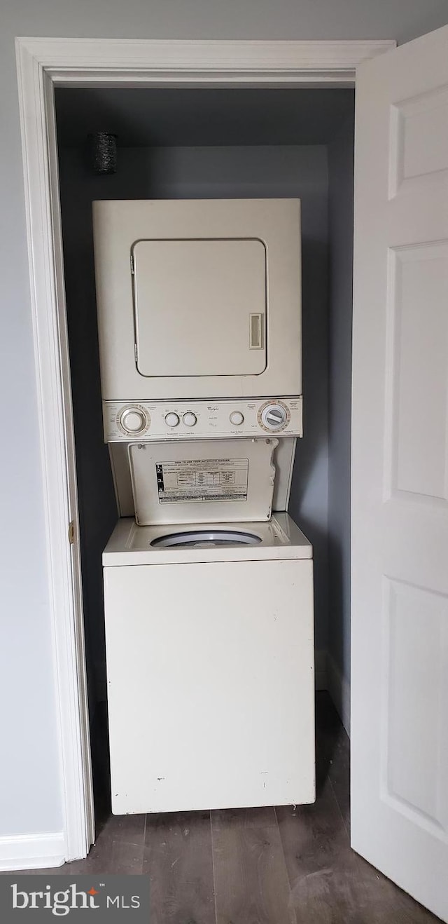 washroom with stacked washer / dryer