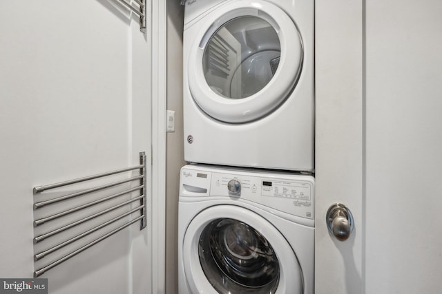 laundry area featuring stacked washer and clothes dryer