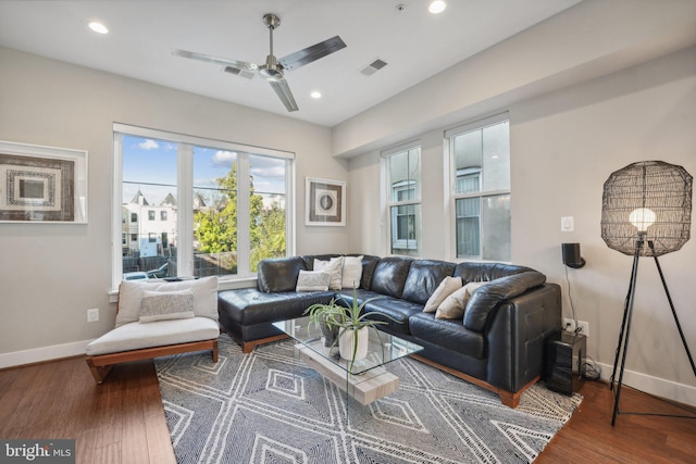 living room with ceiling fan and hardwood / wood-style floors