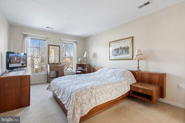 bedroom with light colored carpet