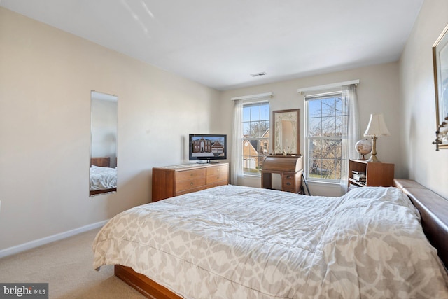 bedroom with light colored carpet