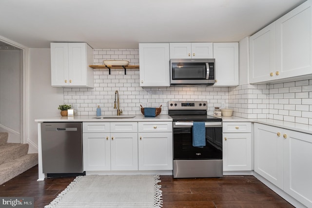 kitchen with white cabinets, sink, and appliances with stainless steel finishes