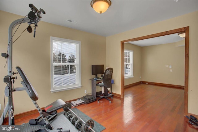 exercise area featuring hardwood / wood-style flooring