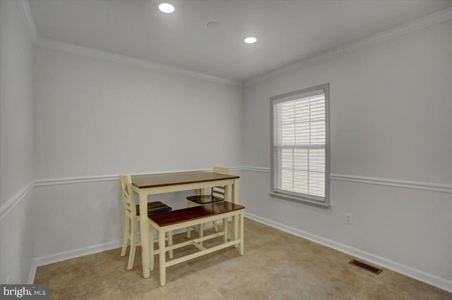 dining area featuring light carpet and crown molding