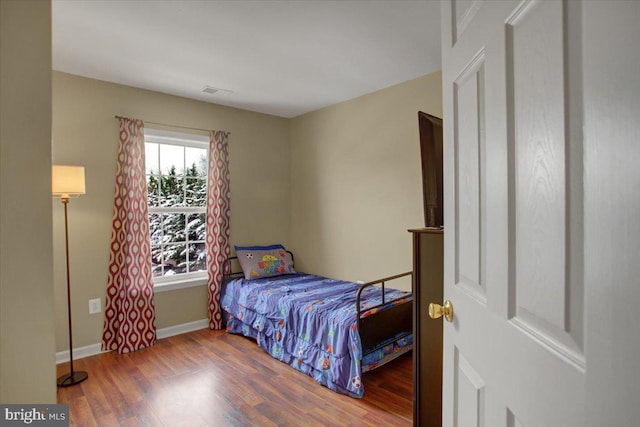 bedroom featuring hardwood / wood-style flooring