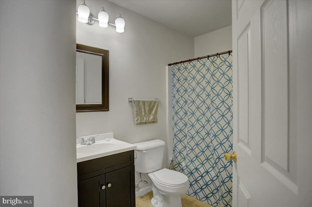 bathroom with vanity, toilet, and a shower with curtain