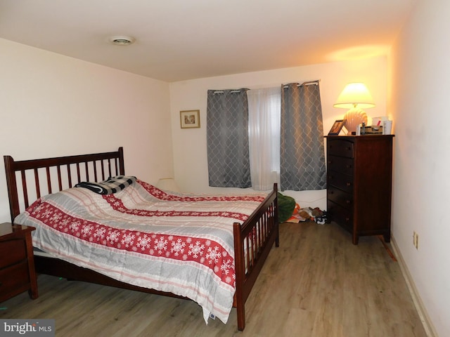 bedroom featuring wood-type flooring