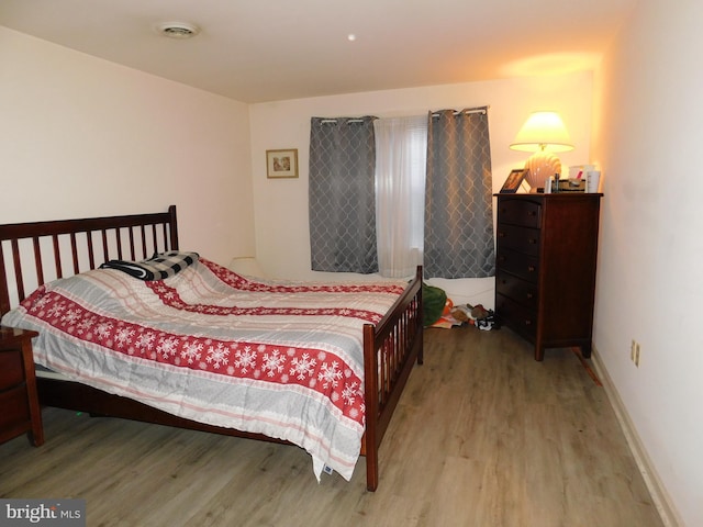 bedroom with light wood-type flooring