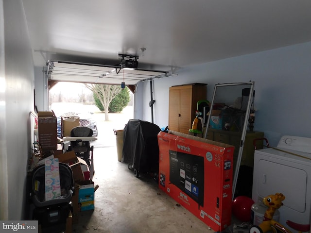 garage with washer / dryer and a garage door opener