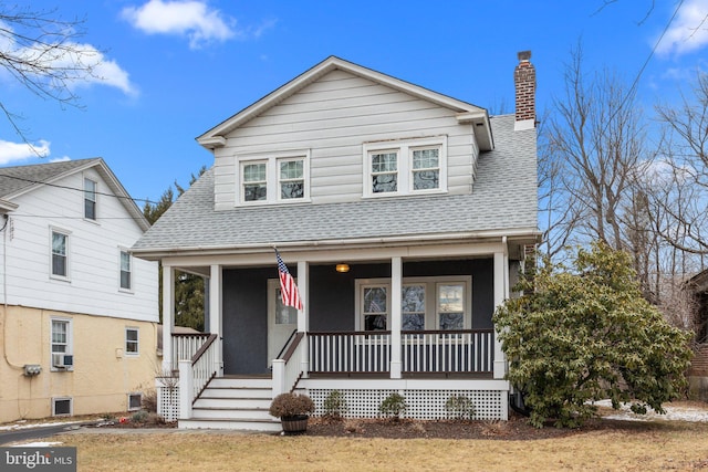 view of front facade featuring cooling unit and covered porch