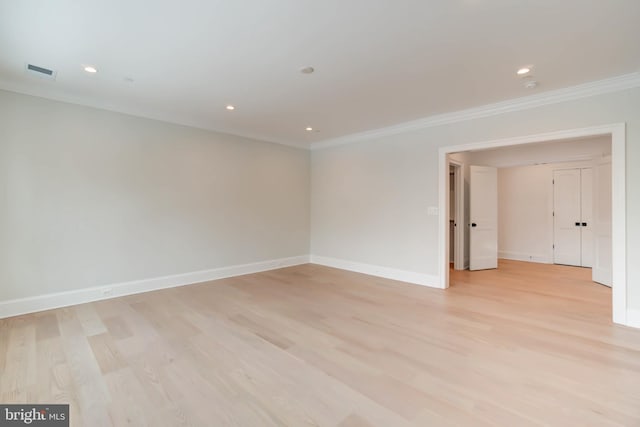 unfurnished room with light hardwood / wood-style floors and ornamental molding