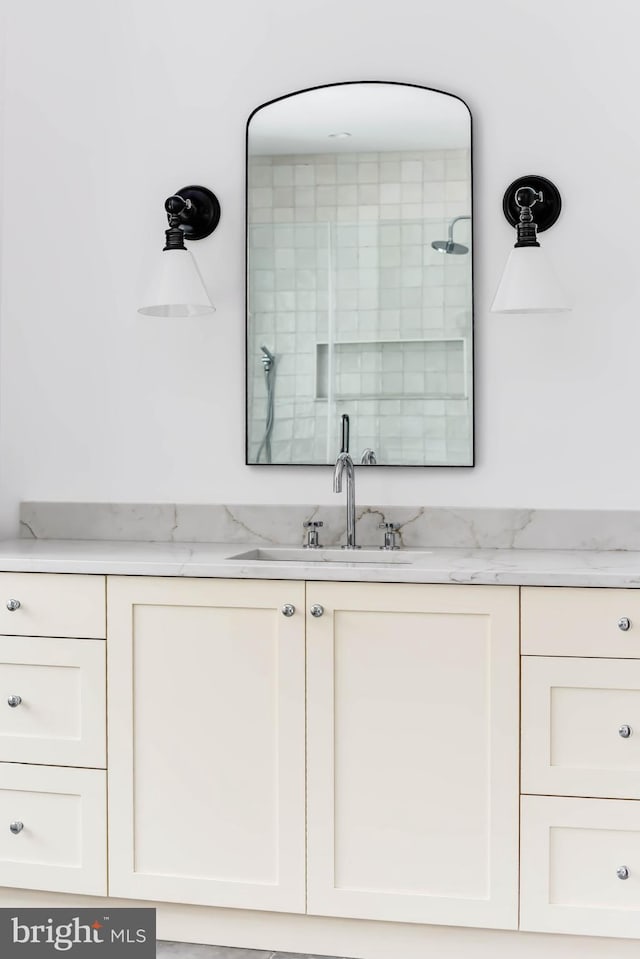 bathroom featuring vanity and walk in shower