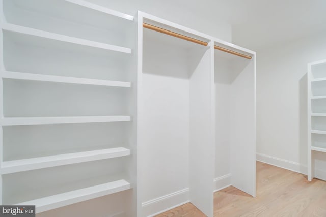 spacious closet with light wood-type flooring