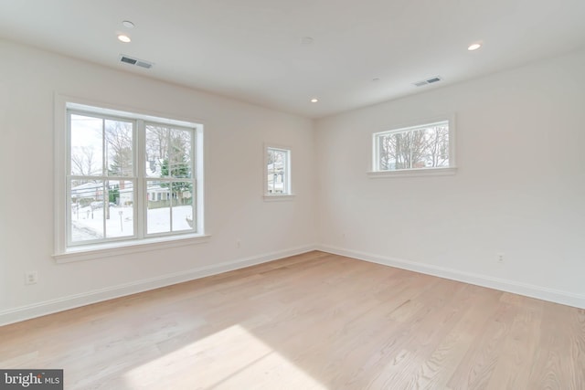 unfurnished room featuring light wood-type flooring