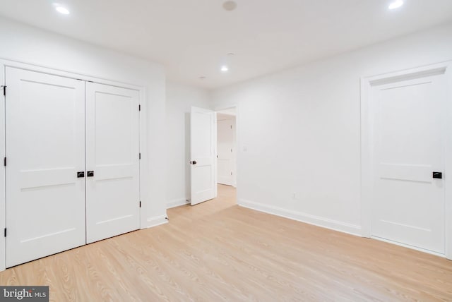 unfurnished bedroom with light hardwood / wood-style floors