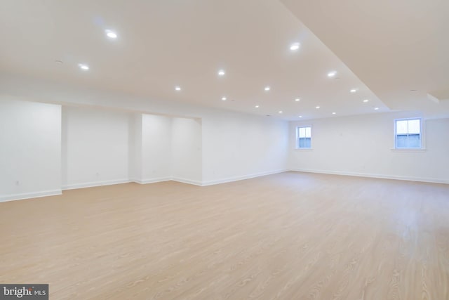 basement featuring light wood-type flooring