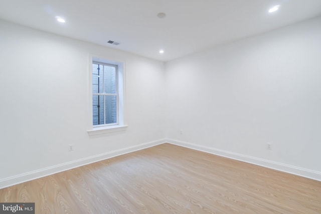 unfurnished room featuring light hardwood / wood-style floors