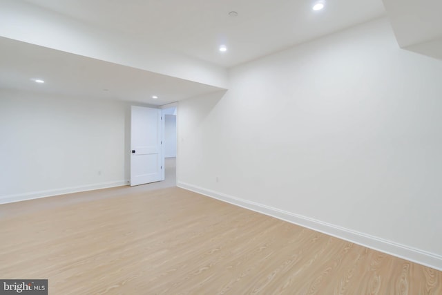 basement featuring light hardwood / wood-style floors