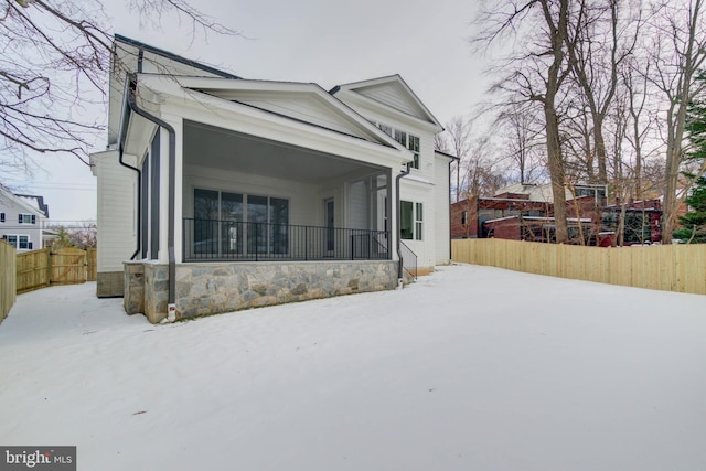 view of snow covered house