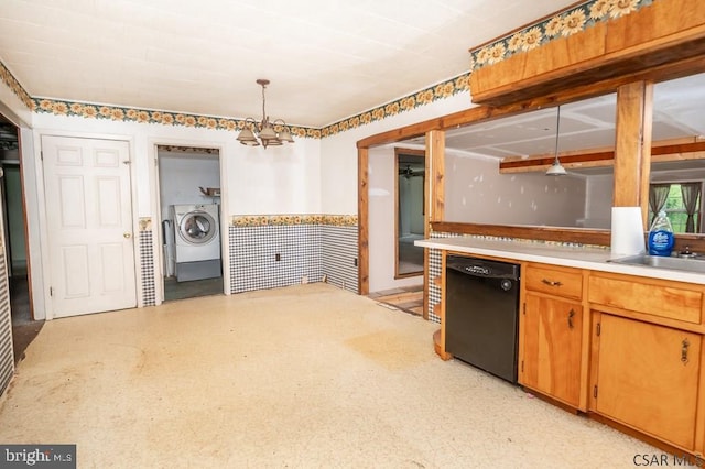 kitchen featuring black dishwasher, hanging light fixtures, and sink