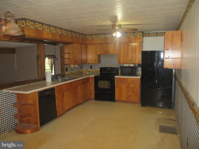 kitchen with black appliances, ceiling fan, kitchen peninsula, and sink