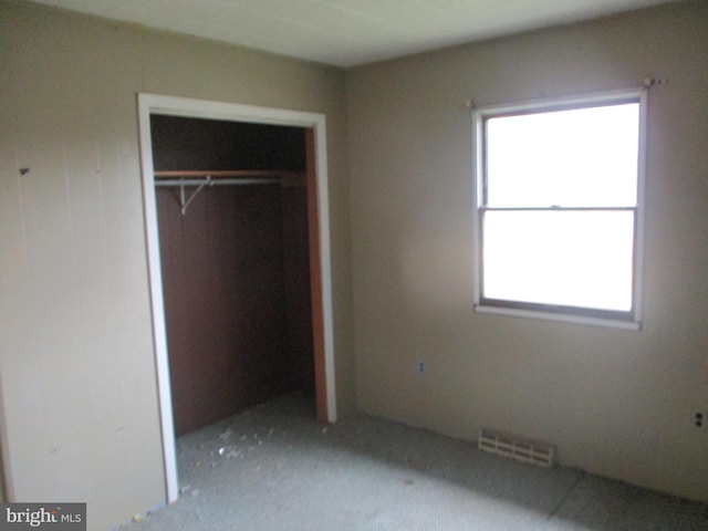 unfurnished bedroom with a closet