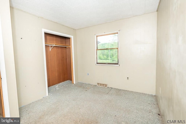 unfurnished bedroom with a closet