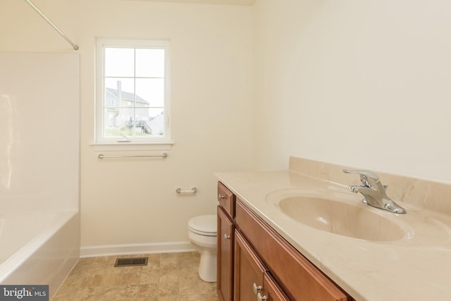 bathroom featuring toilet and vanity