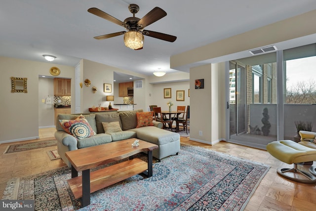 living room featuring ceiling fan