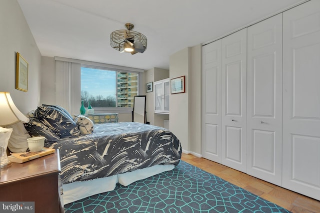 bedroom featuring wood-type flooring and a closet