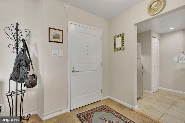 entryway featuring light tile patterned floors