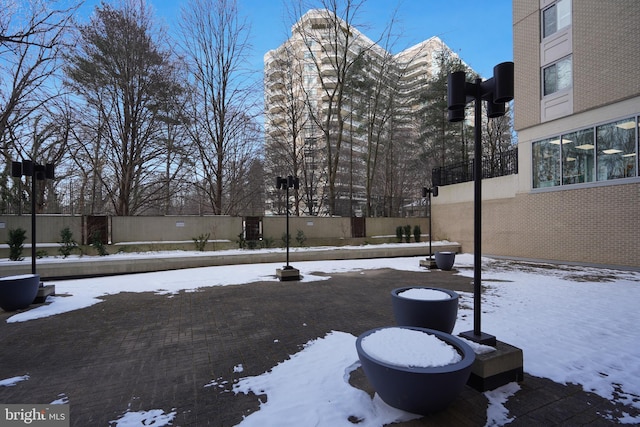 view of yard layered in snow