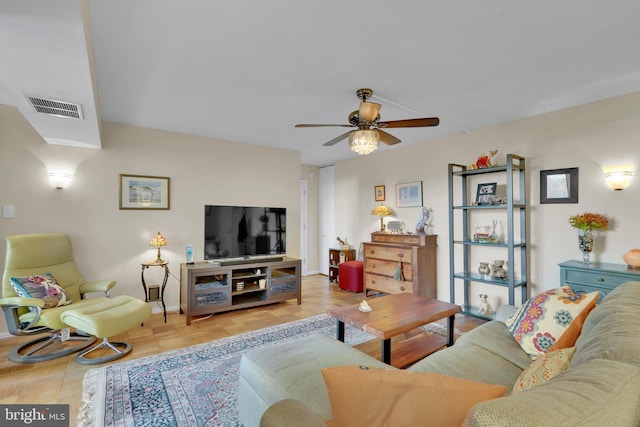 living room with light parquet floors and ceiling fan