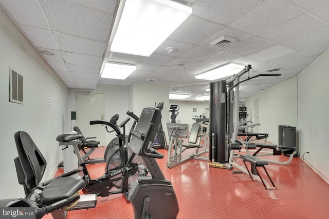 gym featuring a paneled ceiling