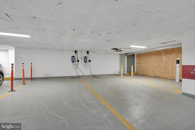 garage featuring wood walls