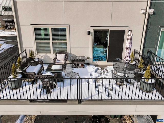 view of snow covered deck