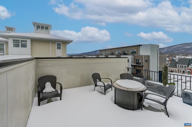 view of patio featuring a balcony and a mountain view